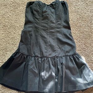 Woman’s strapless black dress